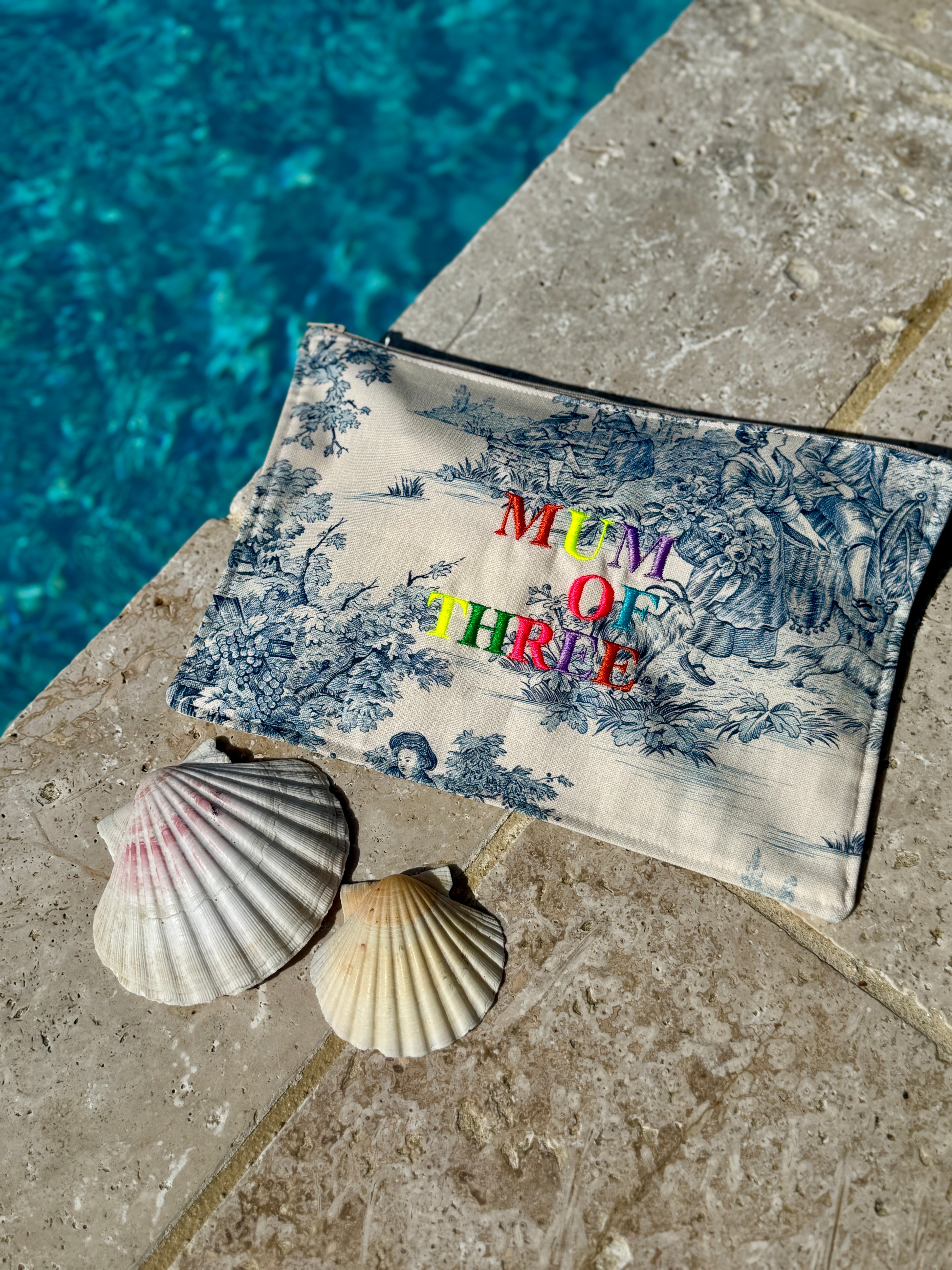 BLUE EMBROIDERED RAINBOW POUCH