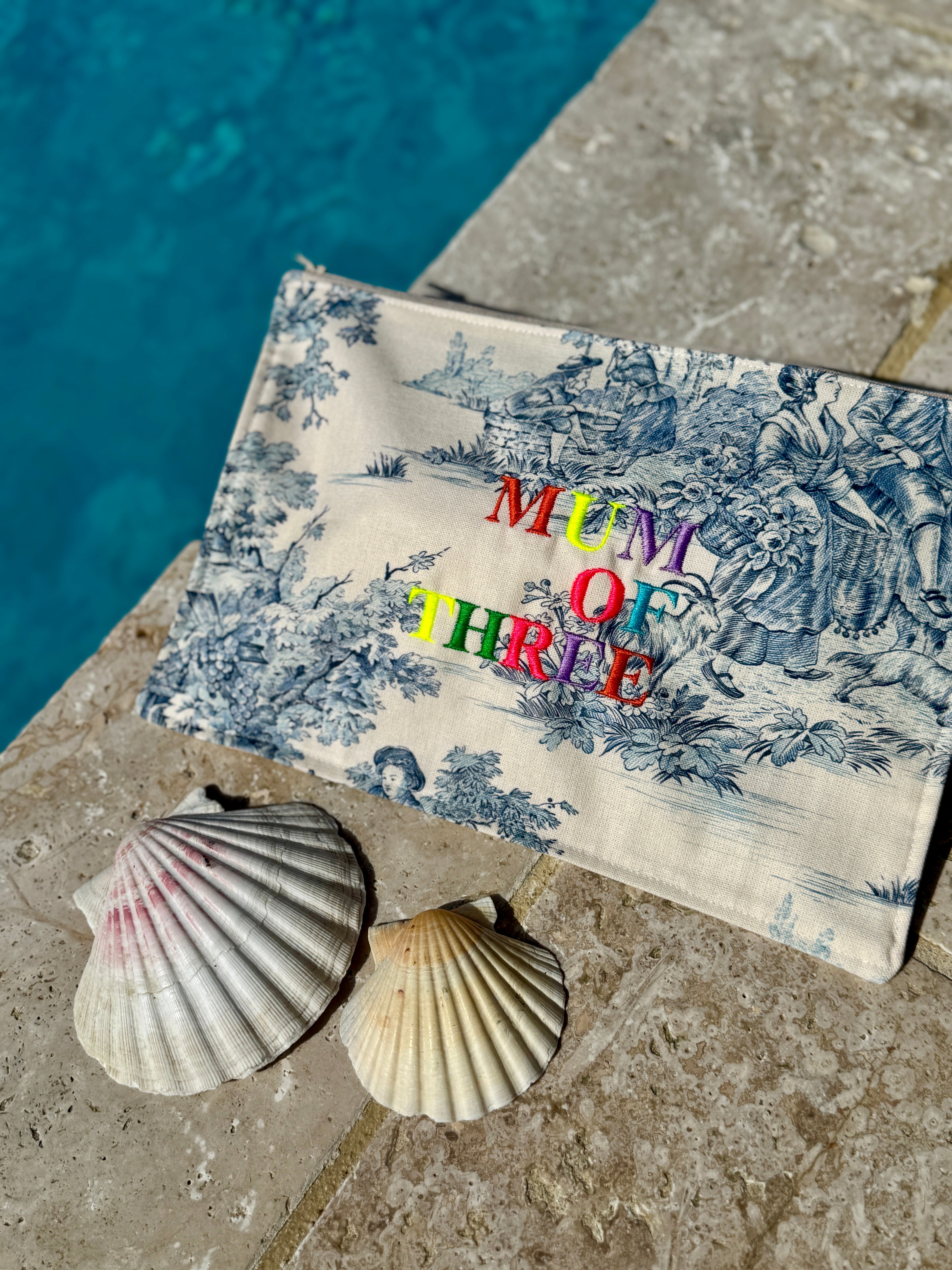 BLUE EMBROIDERED RAINBOW POUCH